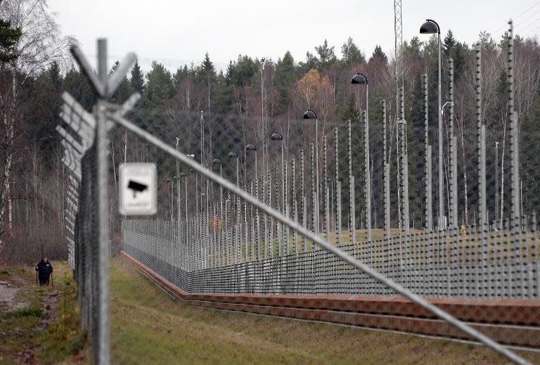 A man takes a walk next to the high-security prison in the town of Norrtaelje, Sweden on November 15, 2013