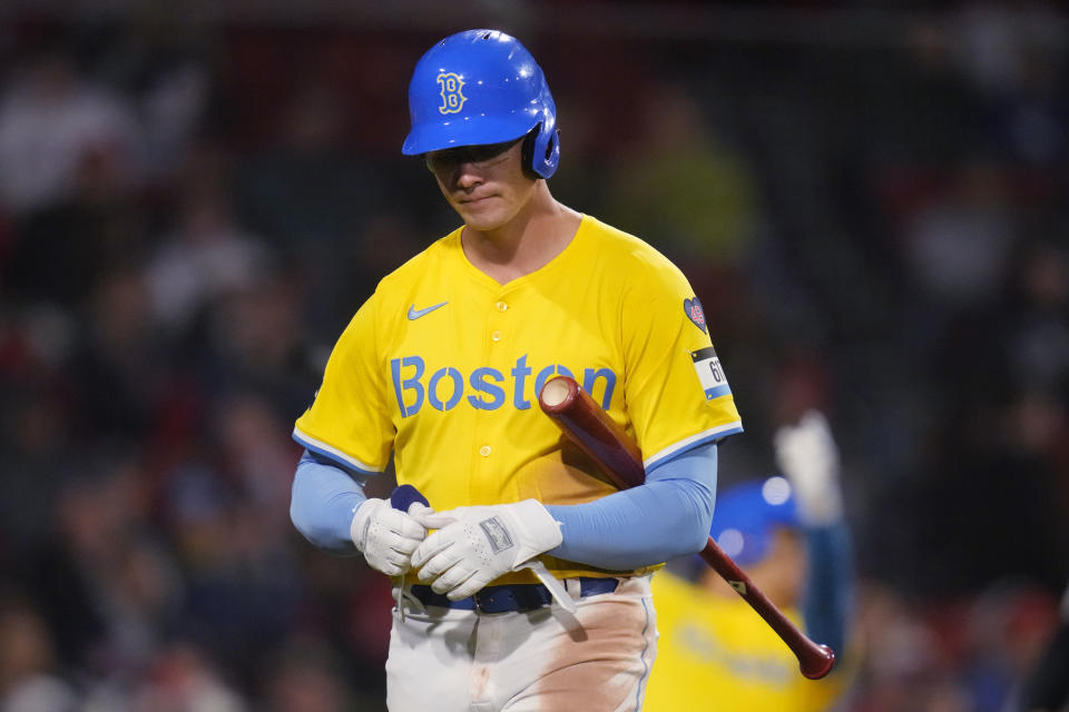 Boston Red Sox's Bobby Dalbec heads back to the dugout after striking out against the Los Angeles Angels during the seventh inning of a baseball game Friday, April 12, 2024, in Boston. (AP Photo/Charles Krupa)