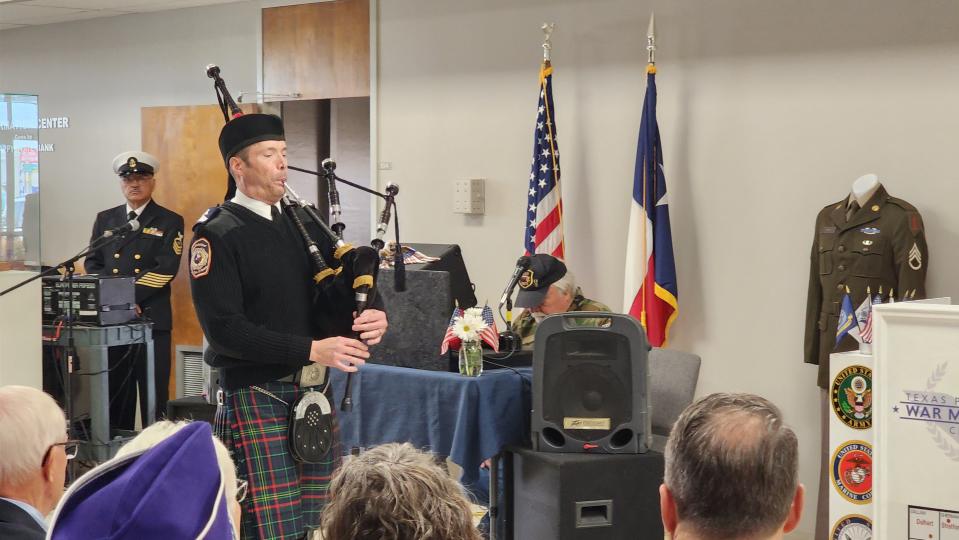 Adam Wilcox of the Amarillo Fire Department plays "Amazing Grace" during the Veterans Day Ceremony Friday at the Texas Panhandle War Memorial Center.