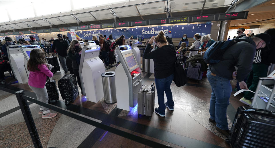 There have been confronting scenes at US airports overnight as millions travel head of the holidays. Source: AP