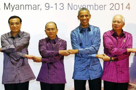 (L-R) China's Premier Li Keqiang, Myanmar's President Thein Sein, U.S. President Barack Obama and Malaysia's Prime Minister Najib Razak join hands as they pose at the 25th Association of Southeast Asian Nations (ASEAN) summit in Naypyitaw, Myanmar, in this file photo taken November 12, 2014. REUTERS/Damir Sagolj/Files