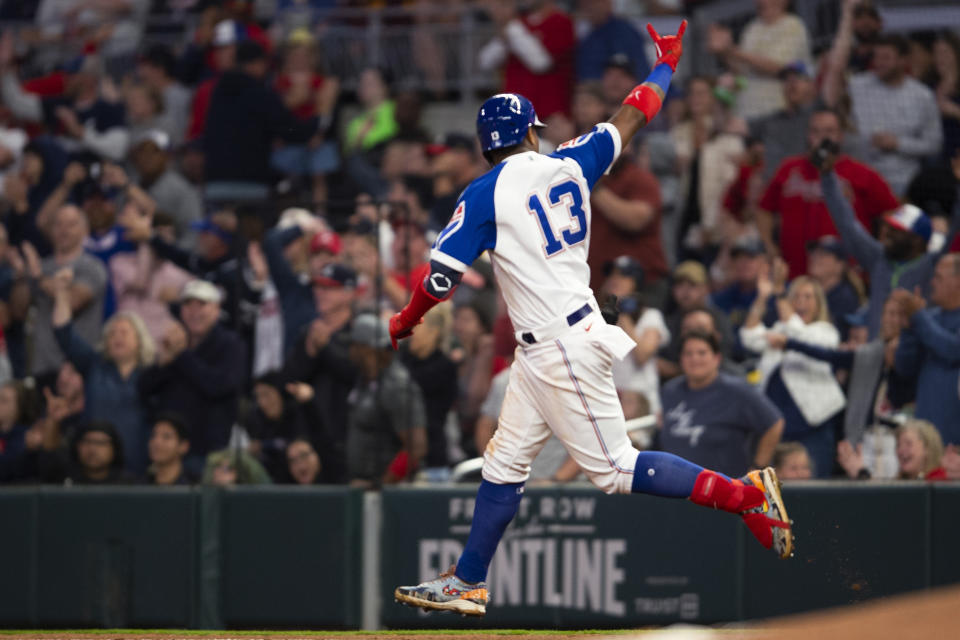 Atlanta Braves' Ronald Acuna Jr. gestures after hitting a solo home run in the fifth inning of the team's baseball game against the Milwaukee Brewers on Saturday, May 7, 2022, in Atlanta. (AP Photo/Hakim Wright Sr)