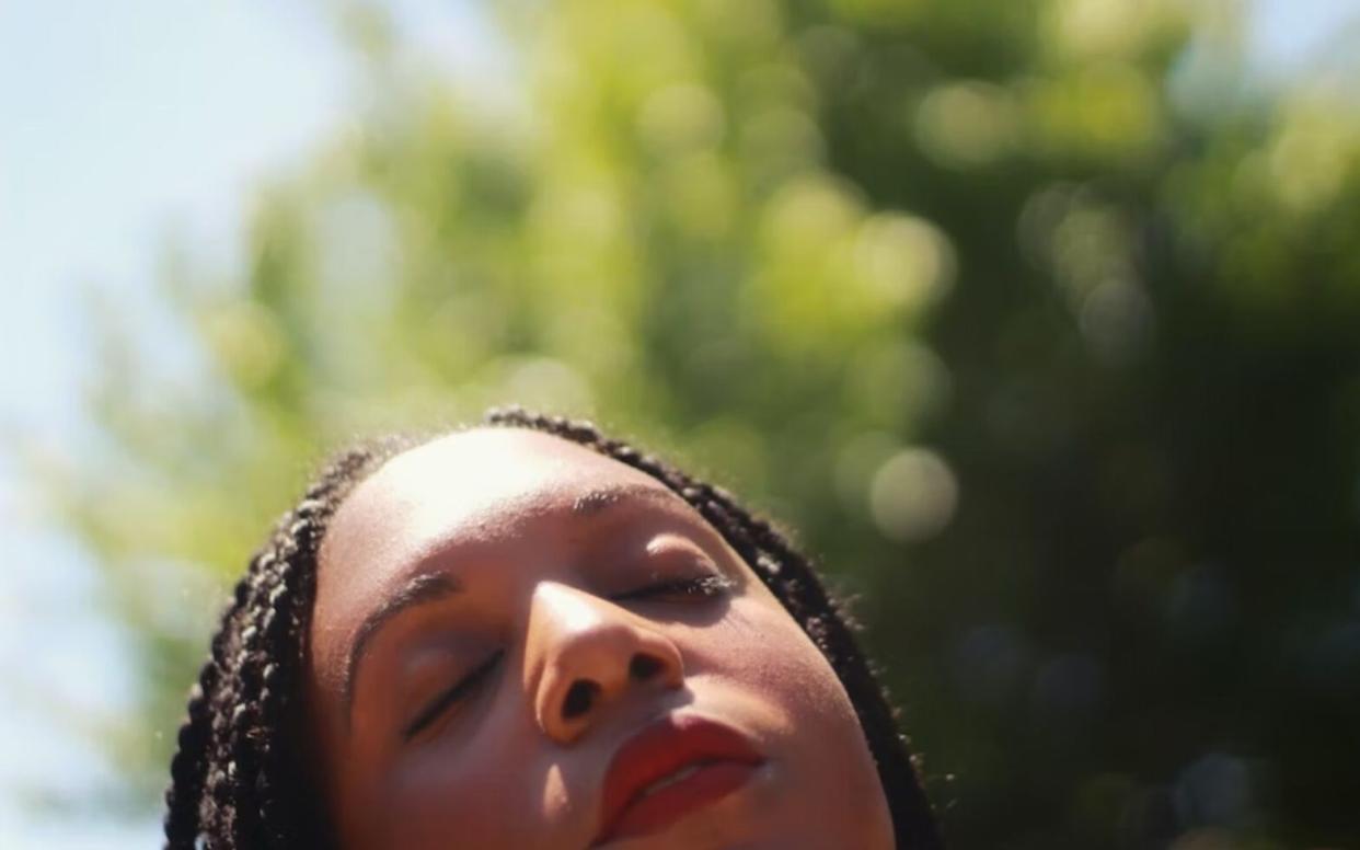 Black woman in sunlight to honor women's history month