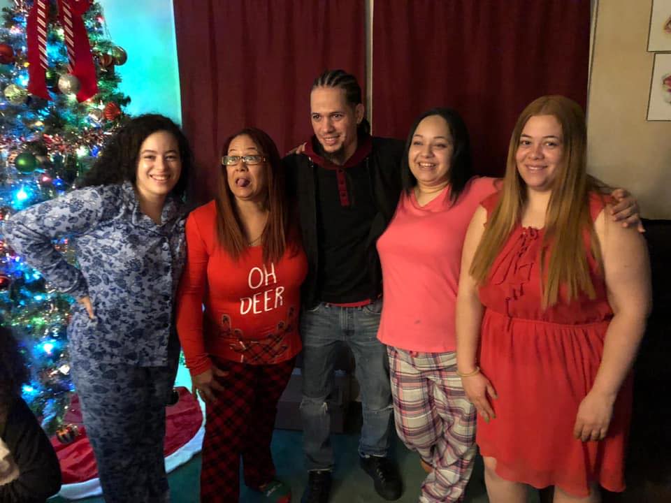 Santos-Batista with his mother and sisters.