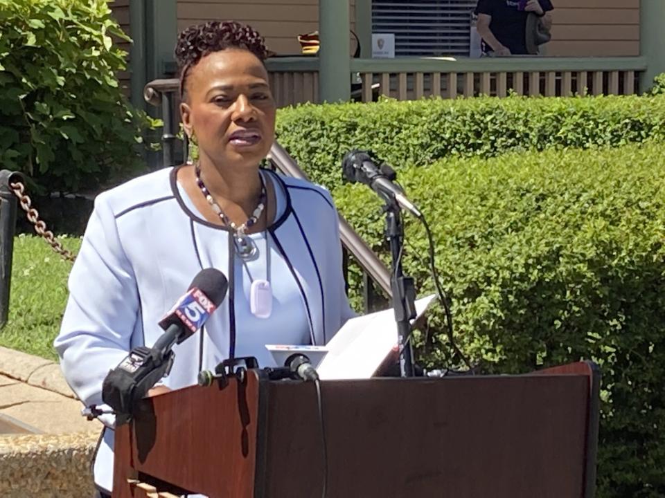 The Rev. Bernice King, daughter of the Rev. Martin Luther King Jr. and CEO of The King Center in Atlanta, speaks in front of her father’s birth home on Wednesday, June 23, 2021, at an event launching “The Official United States Civil Rights Trail” companion book. The U.S. Civil Rights Trail includes more than 120 sites — churches, schools, courthouses, museums — across 15 states, mostly in the South. The new companion book includes more than 200 images of those landmarks today, as well as photographs from the civil rights era. (AP Photo/Kate Brumback)