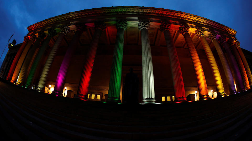 <p>St Georges Hall is illuminated with a rainbow flag following a vigil in memory of the victims of the gay nightclub mass shooting in Orlando, in Liverpool, northern England , June 13, 2016. REUTERS/Phil Noble </p>