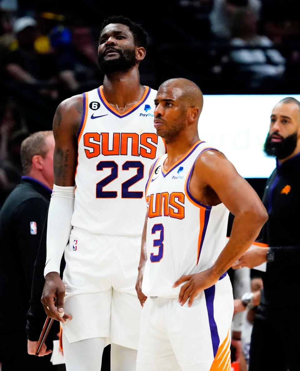 Phoenix Suns center Deandre Ayton (22) and guard Chris Paul (3) against the Denver Nuggets in the first half during Game 2 of the Western Conference Semifinals at Ball Arena in Denver on May 1, 2023.