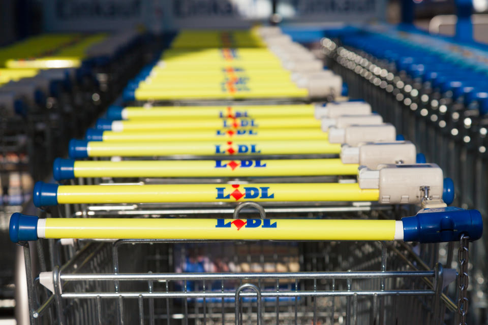 Burg, Germany - November 13, 2016: Shopping carts of the german supermarket chain, Lidl stands together in a row. Lidl is a German global discount supermarket chain, based in Neckarsulm, Germany.