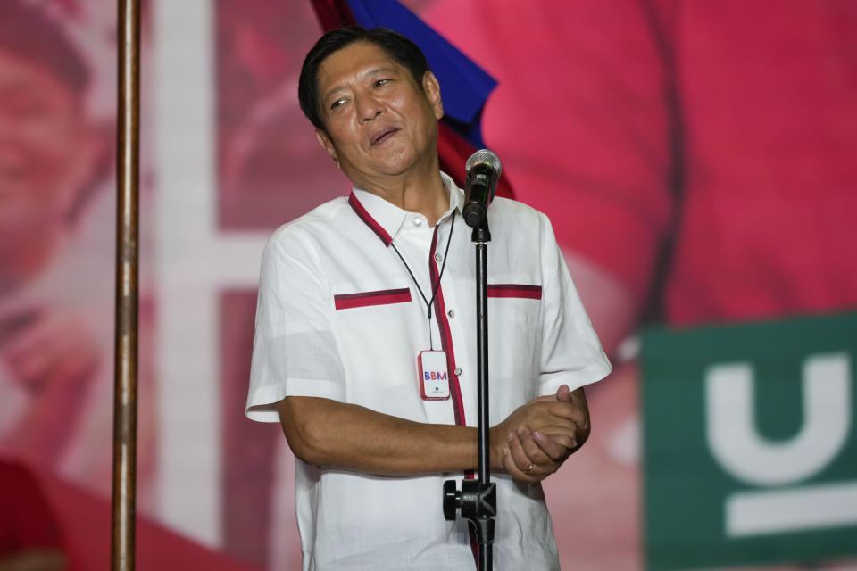 Presidential candidate, Ferdinand Marcos Jr., the son of the late dictator, reacts to the crowd at their last campaign rally known as "Miting De Avance" on Saturday, May 7, 2022 in Paranaque city, Philippines. About 67 million registered Filipino voters will pick a new president on Monday, with Ferdinand Marcos, Jr, son and namesake of the ousted dictator leading pre-election surveys, and incumbent Vice President Leni Robredo, who leads the opposition, as his closest challenger. (AP Photo/Aaron Favila)