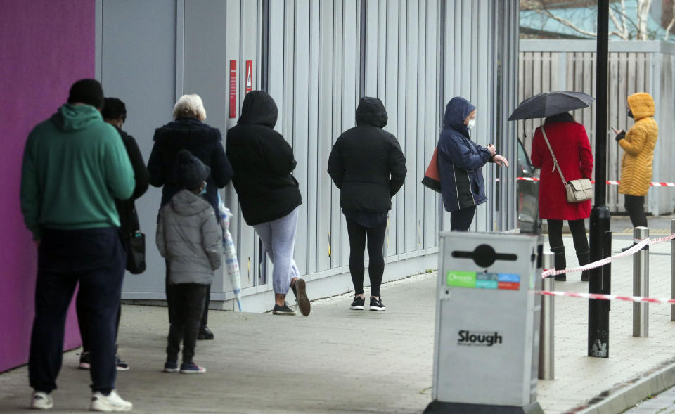 <p>People queue at The Centre in Slough, Berkshire, after a rapid testing hub was opened for locals</p> (PA)