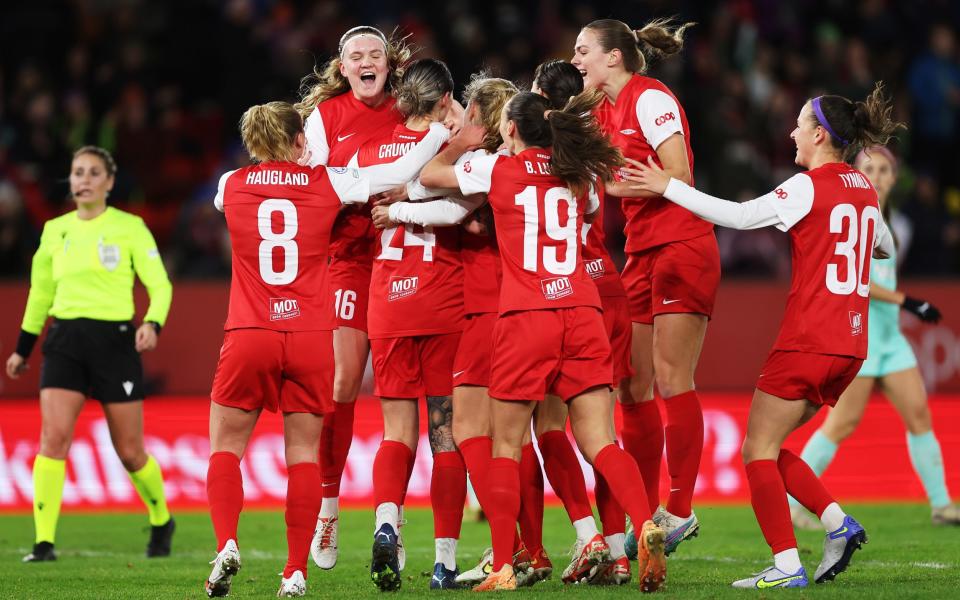 Larissa Crummer of SK Brann celebrates with teammates after scoring the team's first goal during the UEFA Women's Champions League group stage match between SK Brann and SK Slavia Praha at Brann Stadion on November 22, 2023 in Bergen, Norway