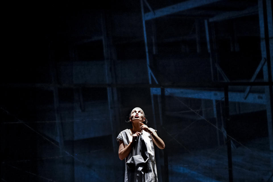 Alexandra Fasola of the Jewish State Theatre performs during the premiere of the "The Beautiful Days of My Youth" play, based on the diary of Romanian Jewish Holocaust survivor Ana Novac, in Bucharest, Friday, Oct. 16, 2020. Maia Morgenstern, head of the Jewish State Theater and a Romanian Jewish actress best known for playing Mary in Mel Gibson's controversial 2004 movie "The Passion of the Christ," described the play's staging in an interview with The Associated Press as an "all-feminine project." (AP Photo/Andreea Alexandru)