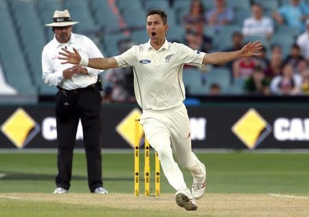New Zealand's Trent Boult (R) celebrates after he dismissed Australia's Adam Voges for 28 runs during the third day of the third cricket test match at the Adelaide Oval, in South Australia, November 29, 2015. REUTERS/David Gray