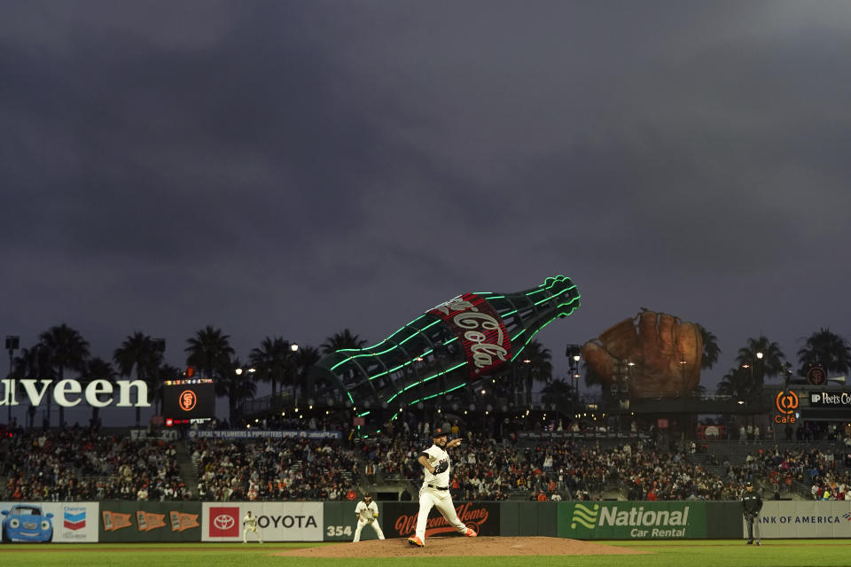 San Francisco Giants' Jarlin Garcia, bottom, pitches against the San Diego Padres during the second inning of a baseball game in San Francisco, Wednesday, Sept. 15, 2021. (AP Photo/Jeff Chiu)