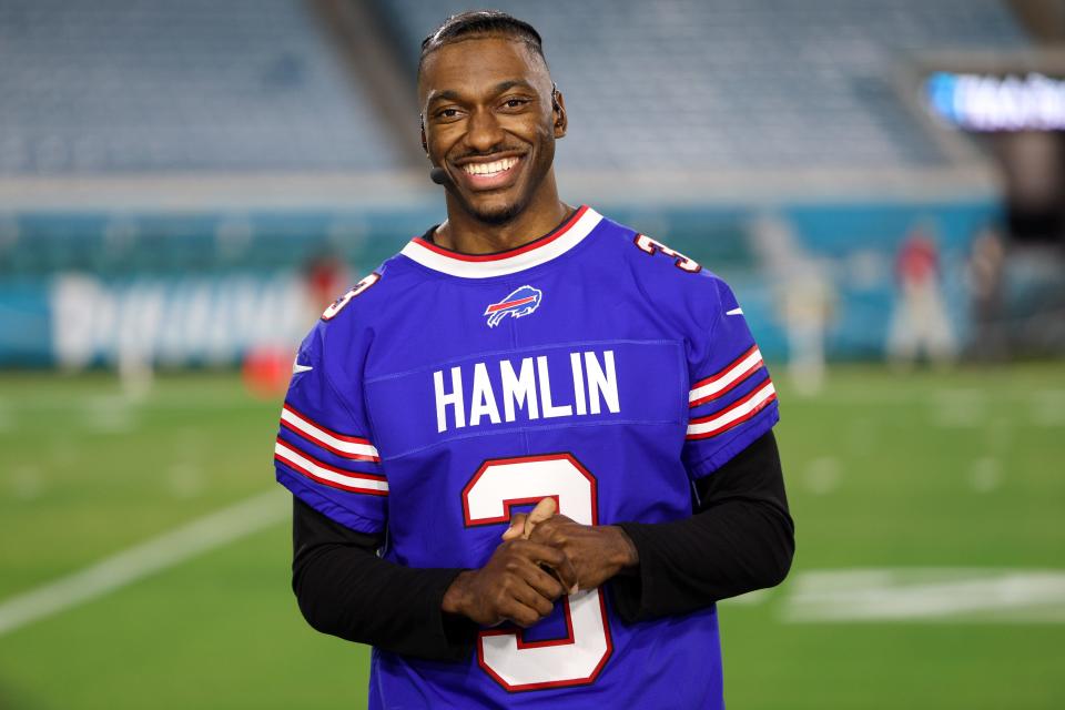 ESPN analyst Robert Griffin III wears Damar Hamlin's jersey.