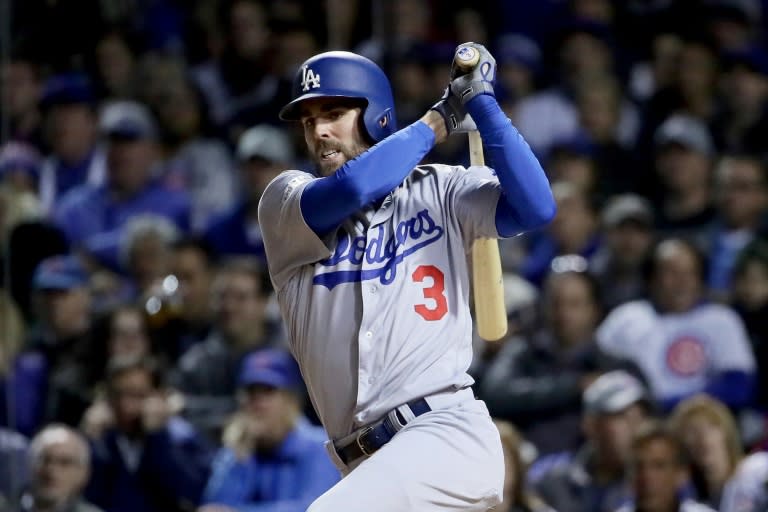 Chris Taylor of the Los Angeles Dodgers hits a triple in the fifth inning against the Chicago Cubs during game three of the National League Championship Series, at Wrigley Field in Chicago, Illinois, on October 17, 2017