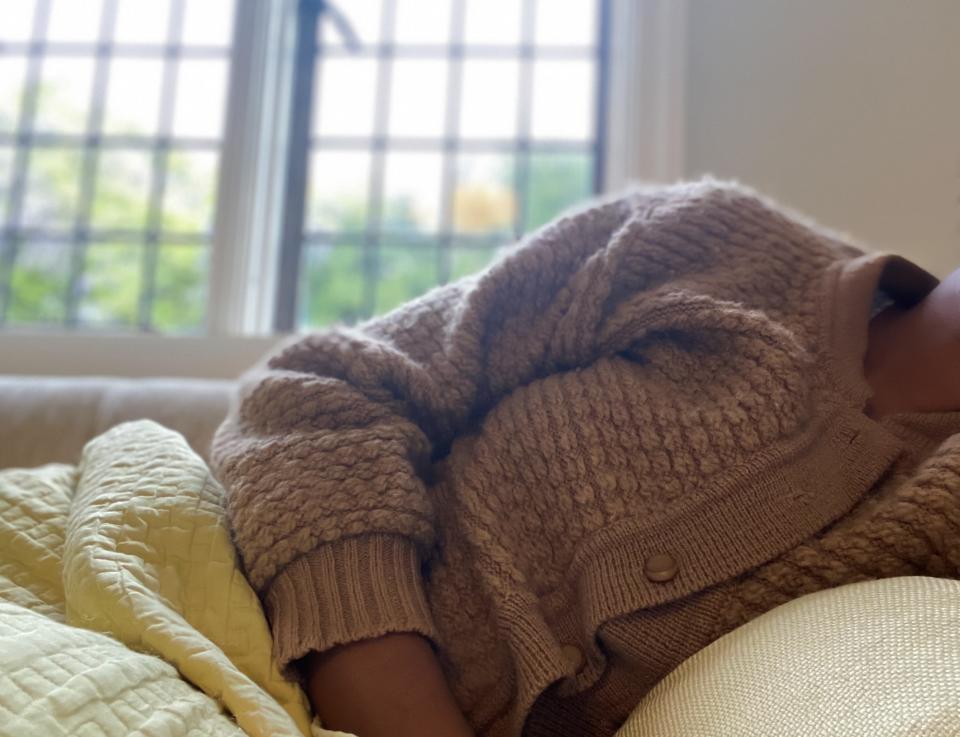 woman resting on the couch