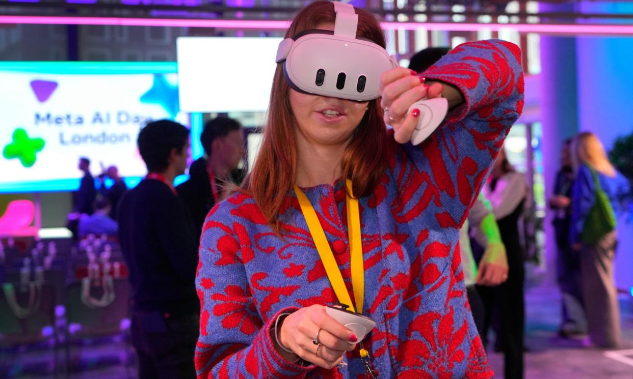 <span>A visitor tries a Meta Quest 3 headset at the Meta AI Day in London, 9 April 2024. </span><span>Photograph: Kirsty Wigglesworth/AP</span>