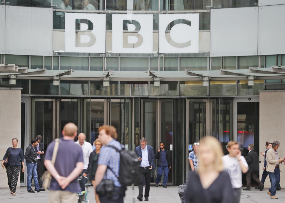 An entrance to the headquarters of the publicly funded BBC in London, Wednesday, July 19, 2017. The BBC published the names and salaries of its highest-earning actors and presenters, Wednesday, compelled by Britain's government to publish the salaries of on-air talent which had previously been secret, revealing that its highest-paid star, radio host Chris Evans, earns more than 2.2 million pounds ($2.9 million) a year. (AP Photo/Frank Augstein)