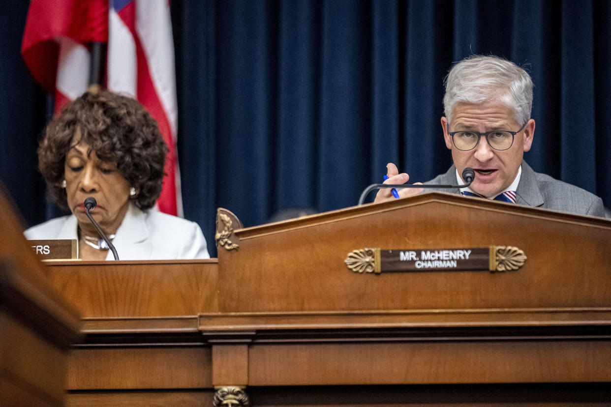 Chairman Rep. Patrick McHenry, R-N.C., right, accompanied by Ranking Member Rep. Maxine Waters, D-Calif., left, speaks as Federal Reserve Chairman Jerome Powell appears before a House Financial Services Committee hearing in Washington, Wednesday, June 21, 2023. (AP Photo/Andrew Harnik)