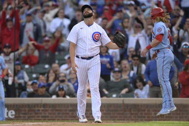 Chicago Cubs closing pitcher Tommy Nance left, reacts after St. Louis Cardinals' Harrison Bader right, scored on a wild pitch during the ninth inning of a baseball game Saturday, Sept. 25, 2021, in Chicago. (AP Photo/Paul Beaty)