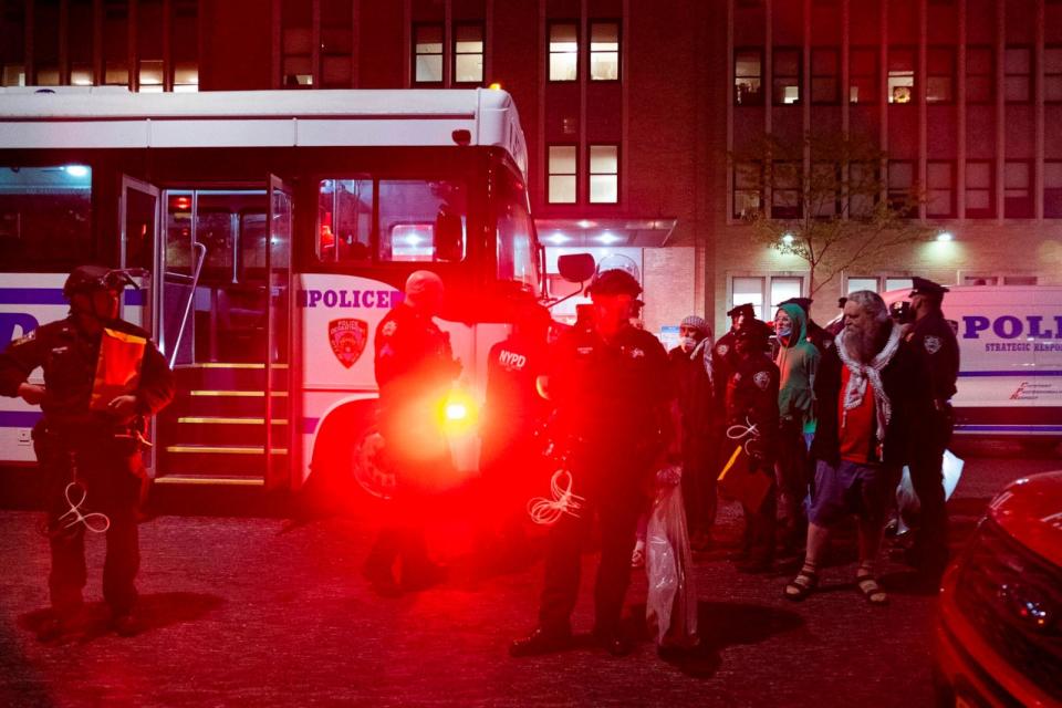 PHOTO: New York Police Department officers arrest Pro-Palestinian demonstrators on 114th Street and Amsterdam Avenue on Tuesday night, April 30, 2024.  (Seyma Bayram/AP)