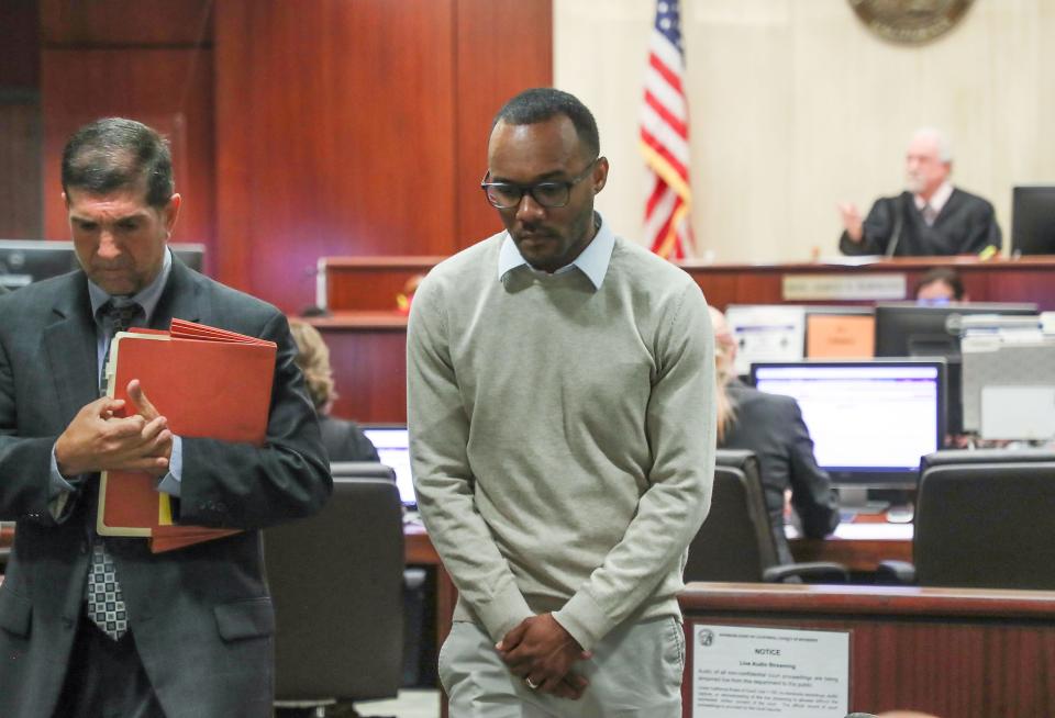 Former Shadow Hills High School basketball coach Ryan Towner, center, exits the courtroom with his counsel David Greenberg after his appearance at the Larson Justice Center in Indio, Calif., June 13, 2022.