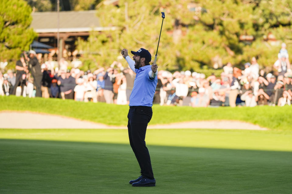 Matthieu Pavon celebrates on the 18th green of the South Course at Torrey Pines after winning the Farmers Insurance Open golf tournament, Saturday, Jan. 27, 2024, in San Diego. (AP Photo/Gregory Bull)