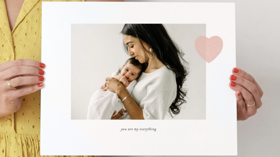 Print and frame an adorable moment between mom and her newborn.