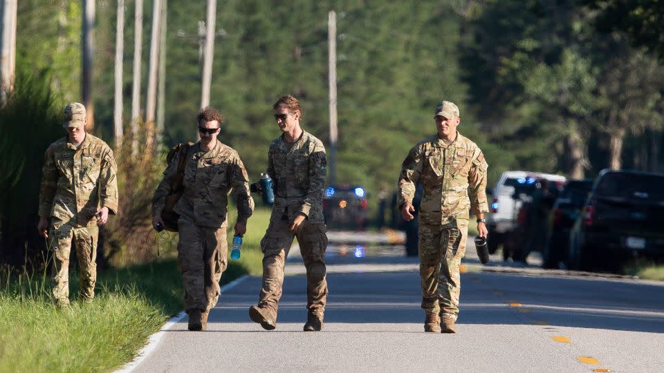 Airmen from Joint Base Charleston during the recovery process for the jet - Henry Taylor/The Post and Courier/AP