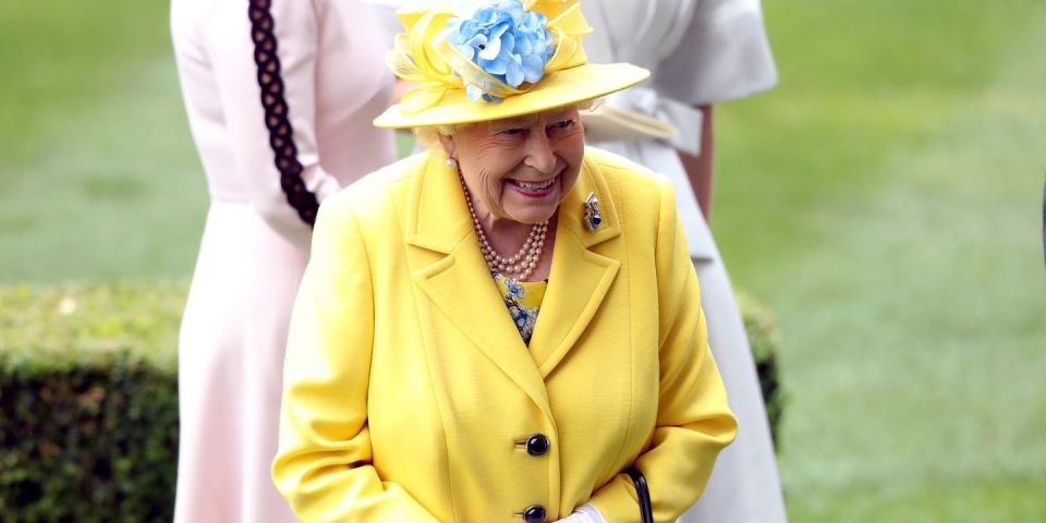 <p>Her Majesty sported a sunny yellow ensemble for the day.</p>