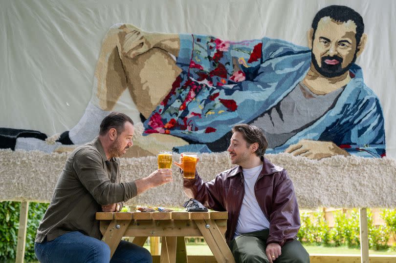 Danny Dyer and Ryan Sampson enjoying a pint in front of the huge rug of Danny Dyer