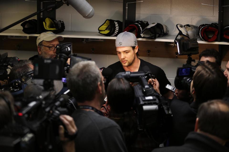 Dallas Stars' Jamie Benn speaks to the media following an NHL hockey practice Tuesday, March 11, 2014, in St. Louis. Teammates are speaking out a day after Stars' Rich Peverley collapsed during a game Monday night in Dallas. Peverley is undergoing testing to determine what triggered his collapse. The Stars are scheduled to play the St. Louis Blues tonight in St. Louis. (AP Photo/Jeff Roberson)