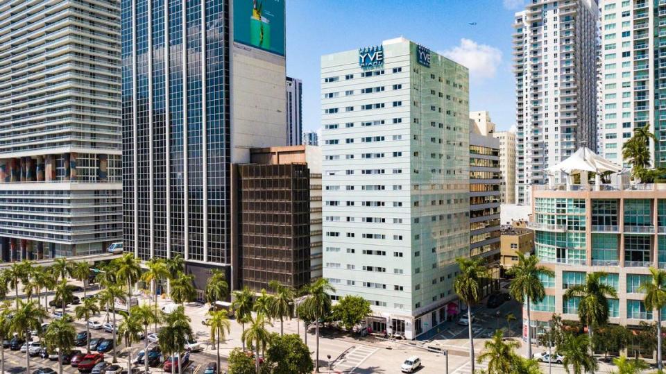 The Yve Hotel at 146 Biscayne Blvd. and the abutting Biscayne Office Center at 141 NE Third Avenue in Miami, Florida as seen on Tuesday, September 19, 2023. A developer plans to demolish the 1920s-era buildings with a super tall tower. These are the last two standing buildings on Biscayne apart from the Freedom Tower dating to the 1920s boom. The Yve was once the Watson, later Miami Colonial hotel, whose Mediterranean stucco facade is hidden under the 1960s panels; it was one of several hotels (the Everglades, McAllister, Columbus) that defined the Miami skyline for decades, all demolished in the ’80s and ’90s.