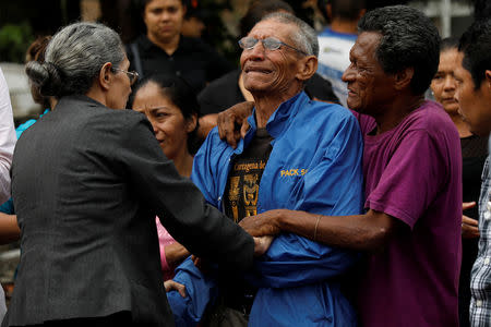 Gilberto, father of Ronald Blanco, 37, who was shot dead outside his house, cries during his funeral, in Tegucigalpa, Honduras, August 3, 2018. REUTERS/Edgard Garrido