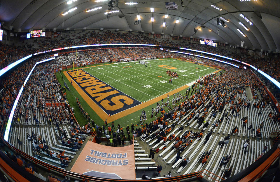 FILE - In this Nov. 9, 2018, file photo, the second half of an NCAA college football game between Syracuse and Louisville is played in the Carrier Dome in Syracuse, N.Y. The 49,000-seat stadium, which serves as home of Syracuse's football and basketball programs, opened in 1980 with a name tied to a large donation made by the heating and air conditioning conglomerate. While the field now carries the name of Ernie Davis, college football's first Black Heisman Trophy winner, the entire facility should be renamed the Jim Brown Dome. (AP Photo/Adrian Kraus, File)
