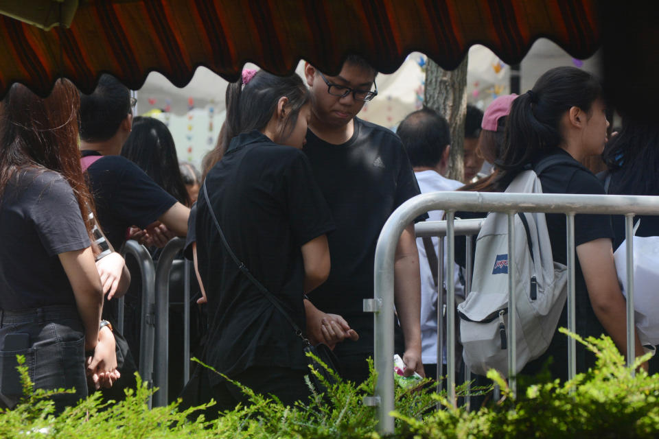 Members of the public lining up at Singapore actor Aloysius Pang's public memorial in Singapore Saturday, Jan. 26, 2019. Pang died from injuries sustained during a military training exercise in New Zealand on Thursday. (AP Photo/Annabelle Liang)