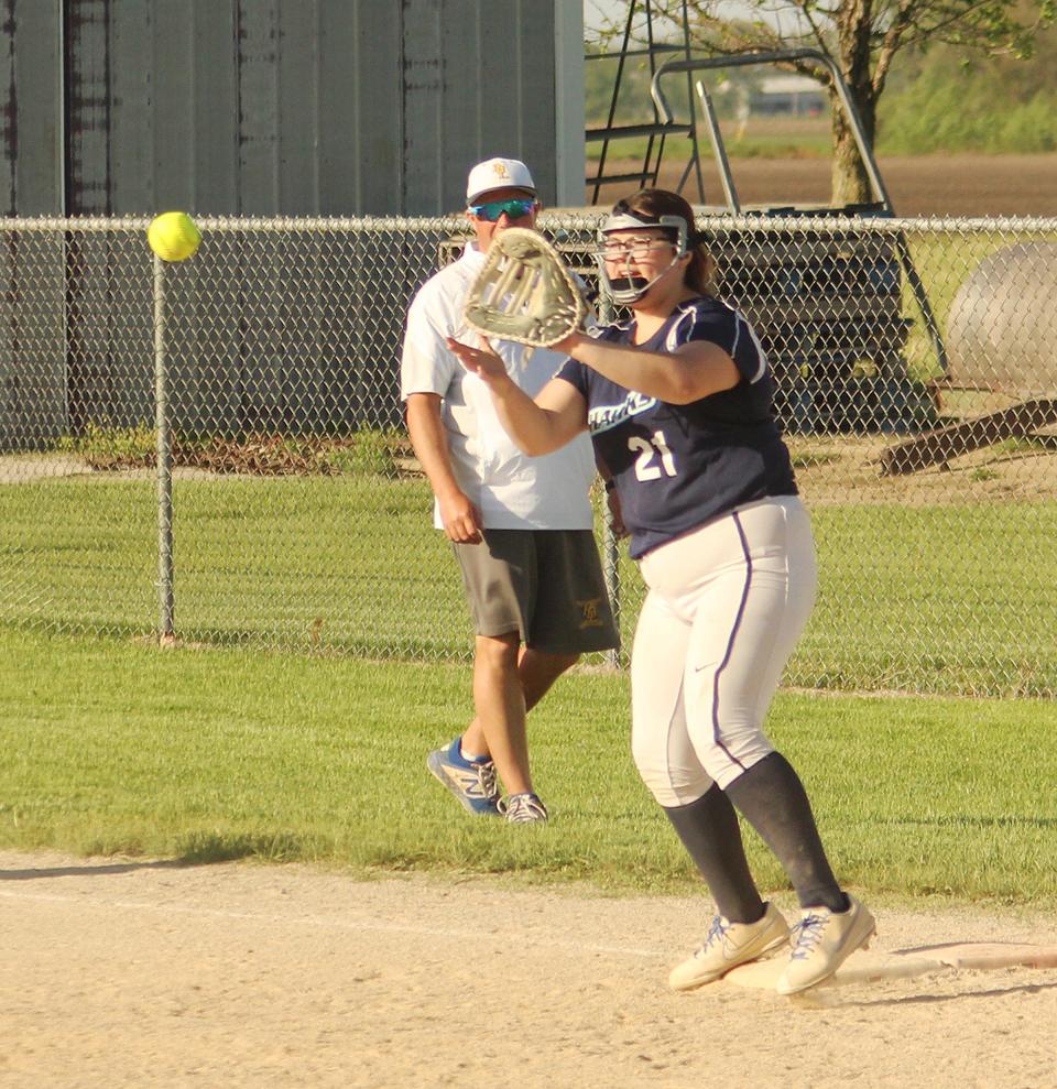 Prairie Central first baseman Lauren Hoselton reaches to catch thte ball for an out during Monday's regional softball game against PBL in Fairbury.