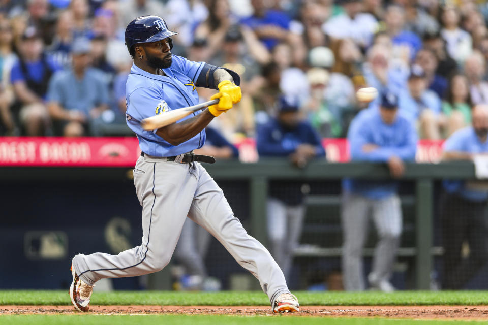 Tampa Bay Rays' Randy Arozarena hits a two-run home run against the Seattle Mariners during the fourth inning of a baseball game, Friday, June 30, 2023, in Seattle. (AP Photo/Caean Couto)