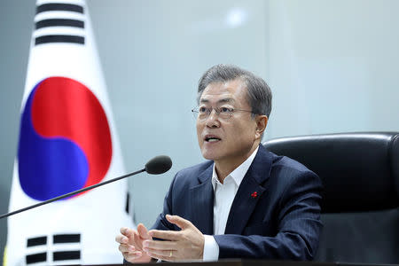 South Korea’s President Moon Jae-in speaks during a meeting with senior aides at the Blue House in Seoul, South Korea, December 12, 2018. Presidential Blue House/Handout via REUTERS