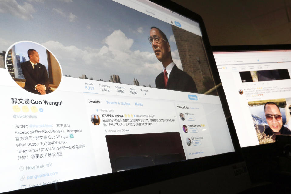 FILE - A Twitter page of Chinese exiled businessman Guo Wengui is seen on a computer screen in Beijing, Aug. 30, 2017. Guo, who left China a decade ago and became a U.S.-based outspoken critic of his homeland's Communist Party, went on trial in New York on Wednesday for what prosecutors say were multiple frauds that cheated hundreds of thousands of people worldwide of over $1 billion. (AP Photo/Andy Wong, File)