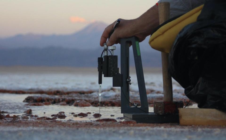 Pieter Visscher using a field gear to measure the chemical make up of the purple microbial mats.