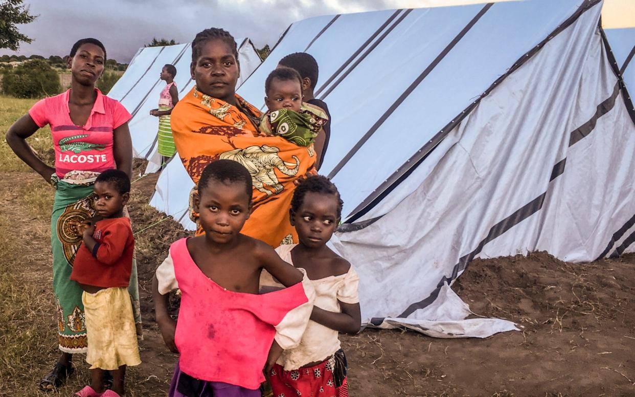 Anastácia José, center, a lone parent of six from Beira, came within a whisker of losing her children when the cyclone hit - LUSA