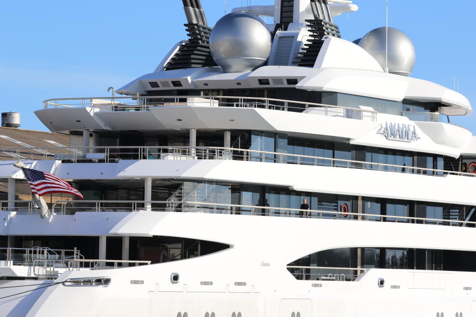 The superyacht Amadea is moored in Honolulu on Thursday, June 16, 2022. The Russian-owned superyacht seized by the United States arrived in Honolulu Harbor flying a U.S. flag after the U.S. last week won a legal battle in Fiji to take the $325 million vessel. (AP Photo/Audrey McAvoy)