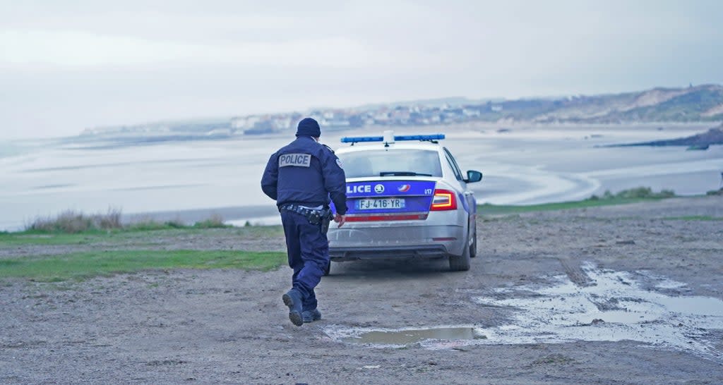 French police on the coast north of Boulogne in northern France at a stretch of beach believed to be used by migrants looking to cross the Channel (PA) (PA Wire)