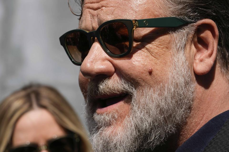 Russel Crowe attends the Giorgio Armani Men's Spring Summer 2025 fashion show, that was presented in Milan, Italy, Monday, June 17, 2024. (AP Photo/Luca Bruno).