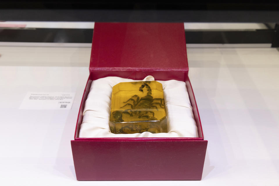 This undated image provided by Heritage Auctions shows a scorpion paperweight prop from the HBO series "Succession." The item was part of an online auction on behalf of HBO at Heritage Auctions in Dallas, which ended Saturday, Jan. 13, 2024. (Heritage Auctions via AP)