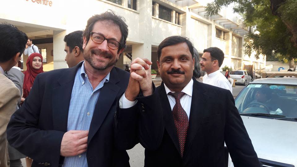 Josh Meyer on a reporting and teaching trip in Karachi, Pakistan in 2016, with Pakistani journalist Khazir Klasra.