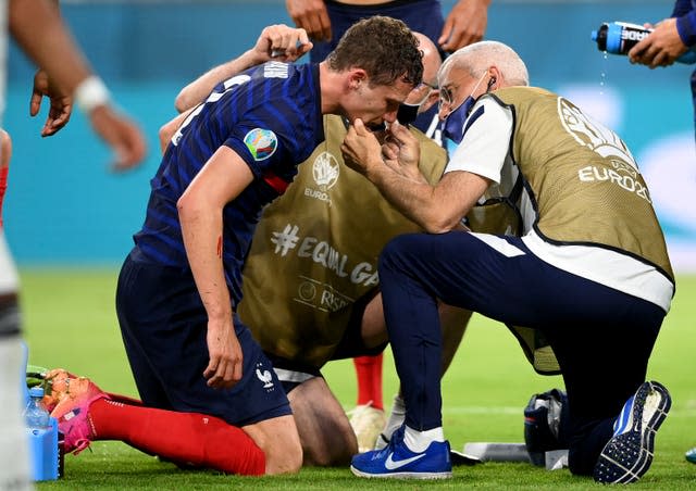 Pavard receives medical attention after his collision