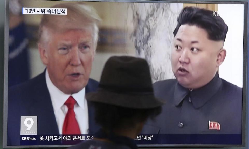 Donald Trump and Kim Jong-un shown on a TV screen